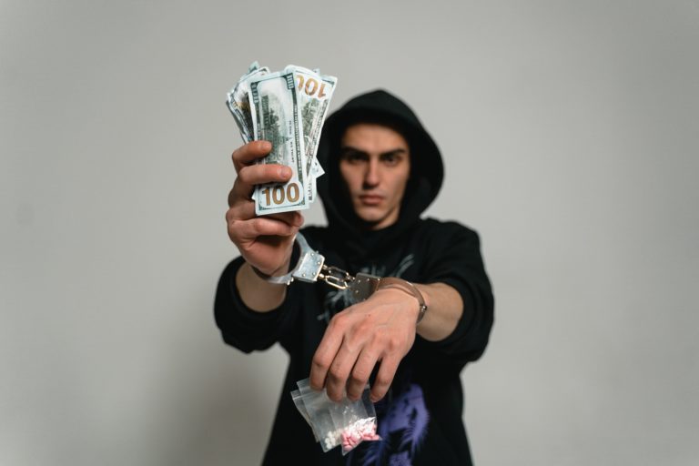 Photo by MART PRODUCTION: https://www.pexels.com/photo/a-man-in-handcuffs-due-to-illegal-drugs-7231479/