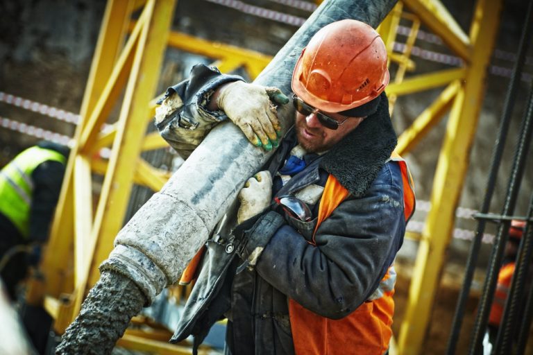 Photo by Yury Kim: https://www.pexels.com/photo/man-carrying-gray-pipe-585419/