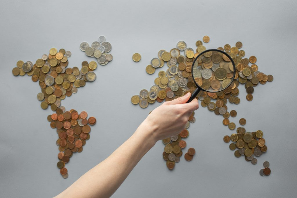 Photo by Monstera: https://www.pexels.com/photo/anonymous-person-magnifying-view-of-coins-shaped-in-world-map-7412098/