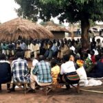 Meeting of people in village in uganda africa