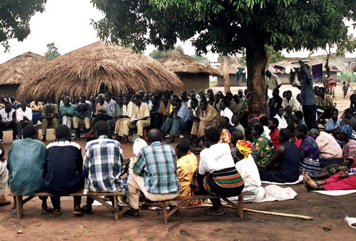 Meeting of people in village in uganda africa