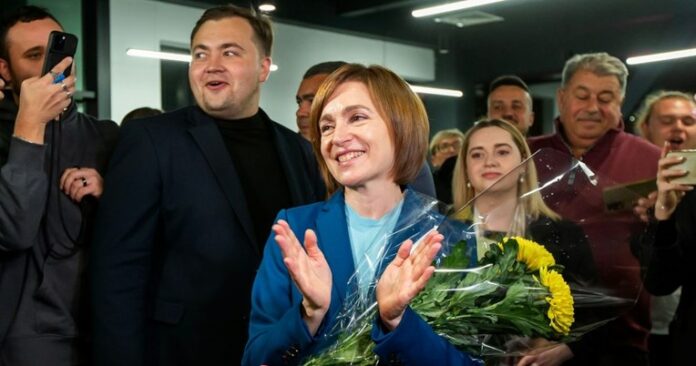 the-incumbent-president-of-moldova-maia-sandu-flanked-by-her-supporters-following-the-announcement-of-the-preliminary-election-results-at-her-campaign-headquarters-in-chisinau-moldova-696x366