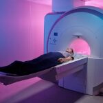 Young,Woman,Lying,On,Long,Table,Of,Medical,Equipment,Before