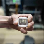 nist-physicist-david-hume-holds-the-newly-modified-ion-trap-for-the-aluminum-ion-clock-credit-r-jacobsonnist-1024x683