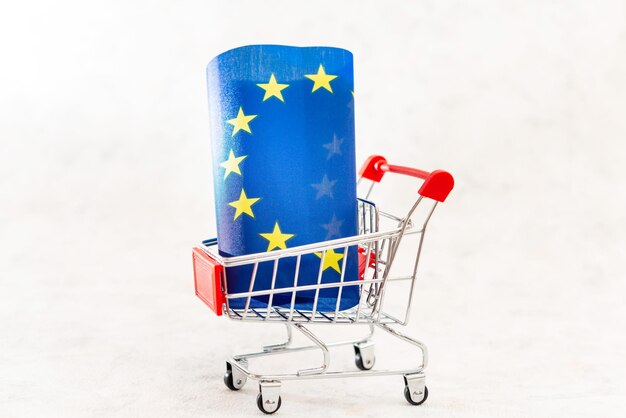 close-up-flag-shopping-cart-against-white-background_1048944-17026994