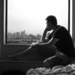 1450205482-man-window-lonely-bw